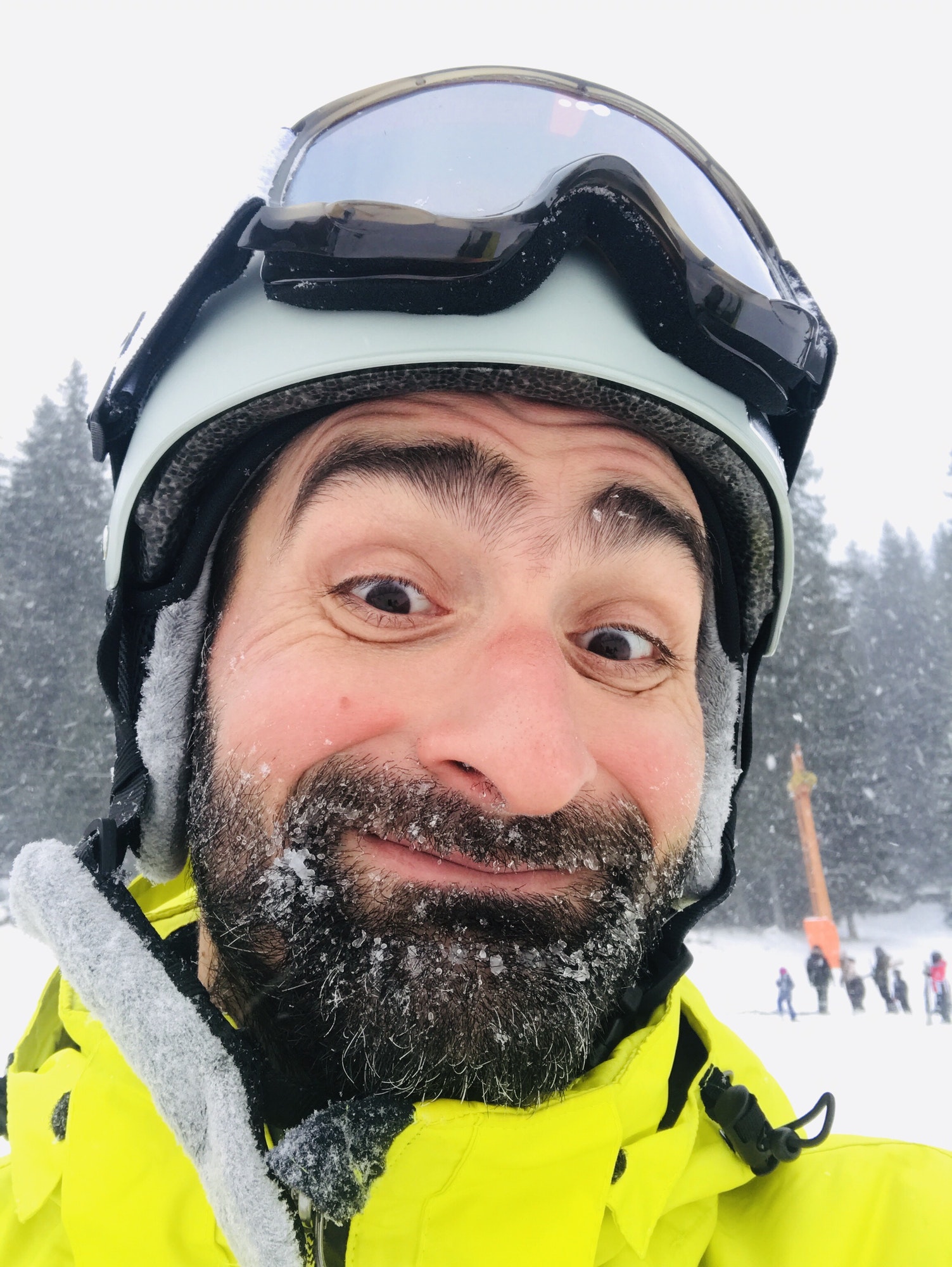 Happy skier with frozen face